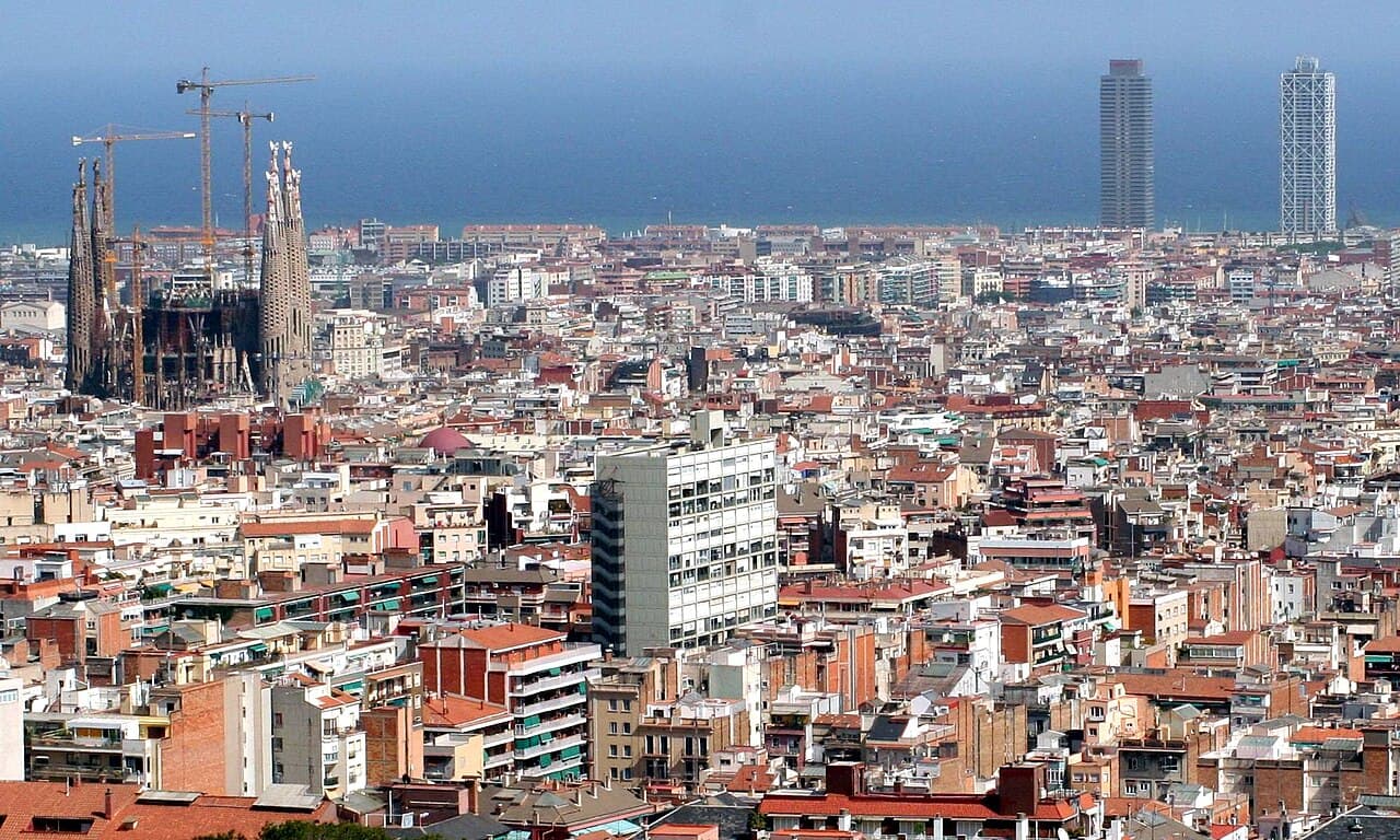 Barcelona rooftops, the Sagrada Família and the Mediterranean